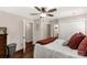 Bedroom features hardwood floors, ample closet space, and a ceiling fan at 4919 Rehobeth Rd, Waxhaw, NC 28173