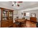 Dining area with a wooden table, hutch, and hardwood floors, perfect for Gathering meals at 4919 Rehobeth Rd, Waxhaw, NC 28173