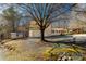 Exterior view of a home with a large yard, complemented by mature trees and a detached garage at 4919 Rehobeth Rd, Waxhaw, NC 28173