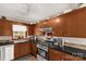 Updated kitchen featuring stainless steel range, ample cabinetry, and a bright window at 4919 Rehobeth Rd, Waxhaw, NC 28173