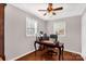 Bright home office with hardwood floors, ceiling fan, and a traditional desk at 4919 Rehobeth Rd, Waxhaw, NC 28173