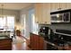 Functional kitchen with stainless steel appliances, granite countertops, and hardwood floors at 522 Sarazen Way, Salisbury, NC 28144