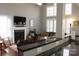 Bright living room featuring a fireplace, hardwood floors, and an open floor plan at 522 Sarazen Way, Salisbury, NC 28144