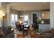 Open concept living area with a dining table, kitchen bar, and seamless transition between spaces at 522 Sarazen Way, Salisbury, NC 28144