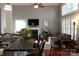 Open living area with a kitchen bar, fireplace, and bright windows, creating an inviting atmosphere at 522 Sarazen Way, Salisbury, NC 28144