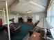 Finished basement featuring a brick fireplace, lounge area, and an exercise area at 536 S Union S St, Concord, NC 28025