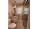 Well-lit bathroom with a tiled shower and a sink with granite countertops at 536 S Union S St, Concord, NC 28025