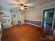 Bedroom featuring bright natural light, hardwood floors, and a convenient closet for storage at 536 S Union S St, Concord, NC 28025