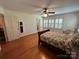 Bedroom with hardwood floors, a ceiling fan, natural light and a neutral color scheme at 536 S Union S St, Concord, NC 28025