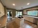Cozy eat-in kitchen features a functional island, ample counter space, and stainless steel appliances at 536 S Union S St, Concord, NC 28025