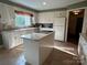 Bright kitchen with a convenient island, a large window and an abundance of cabinet space at 536 S Union S St, Concord, NC 28025