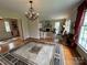 Spacious living room with hardwood floors, a chandelier, and an open doorway to the foyer at 536 S Union S St, Concord, NC 28025