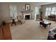 Comfortable living room with a fireplace, large carpet, and a cozy seating area at 536 S Union S St, Concord, NC 28025