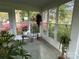 Bright sunroom filled with natural light from large windows and views of the blooming flowers at 536 S Union S St, Concord, NC 28025