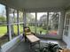 Relaxing sunroom with a chaise lounge and lots of natural light streaming through the large windows at 536 S Union S St, Concord, NC 28025