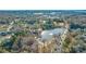 Beautiful aerial view of a community lake surrounded by trees and a scenic path and bridge at 554 Amalfi Dr, Davidson, NC 28036