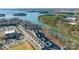 Scenic aerial shot features a lakeside townhome community with boat access and beautiful surroundings at 554 Amalfi Dr, Davidson, NC 28036