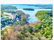 Stunning aerial view of waterfront community with lake access and beautiful landscaping at 554 Amalfi Dr, Davidson, NC 28036