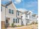 Inviting exterior featuring neutral siding, brick accents, and well-maintained landscaping at 554 Amalfi Dr, Davidson, NC 28036