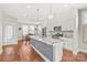 Updated kitchen featuring a center island with granite countertops, stainless steel appliances, and pendant lighting at 554 Amalfi Dr, Davidson, NC 28036