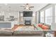 Open-concept living space with a view of the kitchen, fireplace, and comfortable seating at 554 Amalfi Dr, Davidson, NC 28036