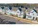 Attractive townhomes line the street with manicured lawns and sidewalks in a desirable community at 554 Amalfi Dr, Davidson, NC 28036