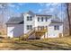 Exterior of house featuring a deck, stairs, white siding, and many windows at 606 Saint Cloud Dr, Statesville, NC 28625