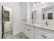 Modern bathroom with double sinks, granite counters, framed mirrors, and a private toilet room at 606 Saint Cloud Dr, Statesville, NC 28625