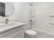 Clean bathroom featuring a vanity with a modern faucet, toilet, and shower-tub combo at 606 Saint Cloud Dr, Statesville, NC 28625