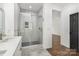 Modern bathroom boasts a glass-enclosed shower with elegant tile work and updated fixtures at 606 Saint Cloud Dr, Statesville, NC 28625