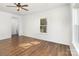 The bedroom is well-lit with hardwood floors, a ceiling fan, and ample natural light at 606 Saint Cloud Dr, Statesville, NC 28625