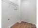A closet is designed with shelves and metal rods for organized storage and convenience at 606 Saint Cloud Dr, Statesville, NC 28625
