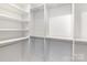 Walk-in closet featuring built-in shelving and racks for optimal organization and storage solutions at 606 Saint Cloud Dr, Statesville, NC 28625