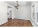 Elegant dining room with modern lighting fixtures and a view of the kitchen, perfect for entertaining guests at 606 Saint Cloud Dr, Statesville, NC 28625