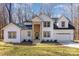 Beautiful two-story home with white siding, brick accents, and a well-manicured front yard at 606 Saint Cloud Dr, Statesville, NC 28625