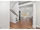 Bright foyer with hardwood floors, staircase, and large windows offering natural light throughout the home at 606 Saint Cloud Dr, Statesville, NC 28625
