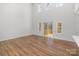 Spacious living room with high ceilings, hardwood floors, and a sliding glass door leading to the outdoor deck at 606 Saint Cloud Dr, Statesville, NC 28625