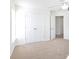 Bedroom showcasing carpet, a ceiling fan, double closets, and a window allowing natural light at 6420 Tunston Ln, Charlotte, NC 28269