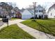 Charming two-story home featuring a two-car garage, well-maintained lawn, and classic white exterior at 6420 Tunston Ln, Charlotte, NC 28269
