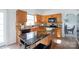 Bright kitchen with wood cabinets, an island with granite countertop, and stainless steel appliances at 6420 Tunston Ln, Charlotte, NC 28269