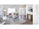 Bright living room with neutral decor, hardwood floors, a console table, and ample natural light at 6420 Tunston Ln, Charlotte, NC 28269