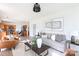 Open-concept living space with a view of the kitchen, stylish decor, and ample natural light at 6420 Tunston Ln, Charlotte, NC 28269