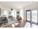 Cozy living room with a fireplace, large windows, and stylish decor at 6420 Tunston Ln, Charlotte, NC 28269