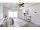 Spacious main bedroom with tray ceiling, neutral decor, and console table at 6420 Tunston Ln, Charlotte, NC 28269
