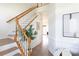 Elegant staircase with wooden rails and white balusters, leading to the home's upper level at 6420 Tunston Ln, Charlotte, NC 28269