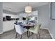 Stylish dining area adjacent to kitchen with plenty of room and natural light at 6738 Rothchild Dr, Charlotte, NC 28270