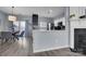 Cozy dining area with modern lighting and adjacent to the kitchen featuring sleek countertops at 6738 Rothchild Dr, Charlotte, NC 28270