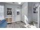 Welcoming entryway with a decorative cabinet and coat closet near a staircase and the front door at 6738 Rothchild Dr, Charlotte, NC 28270
