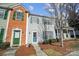 Charming townhome with colorful shutters and well-manicured landscaping at 6738 Rothchild Dr, Charlotte, NC 28270