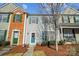Charming townhouse with colorful shutters, a welcoming front door, and well-maintained landscaping at 6738 Rothchild Dr, Charlotte, NC 28270